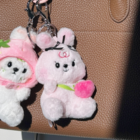 Oakhee keychain plush attached to bag in lifestyle setting