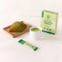 clöud café matcha latte in a cup, sachet, package, and a green croissant behind a white background