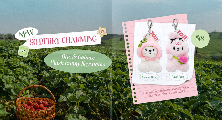 Plush bunny keychains with a berry-themed background