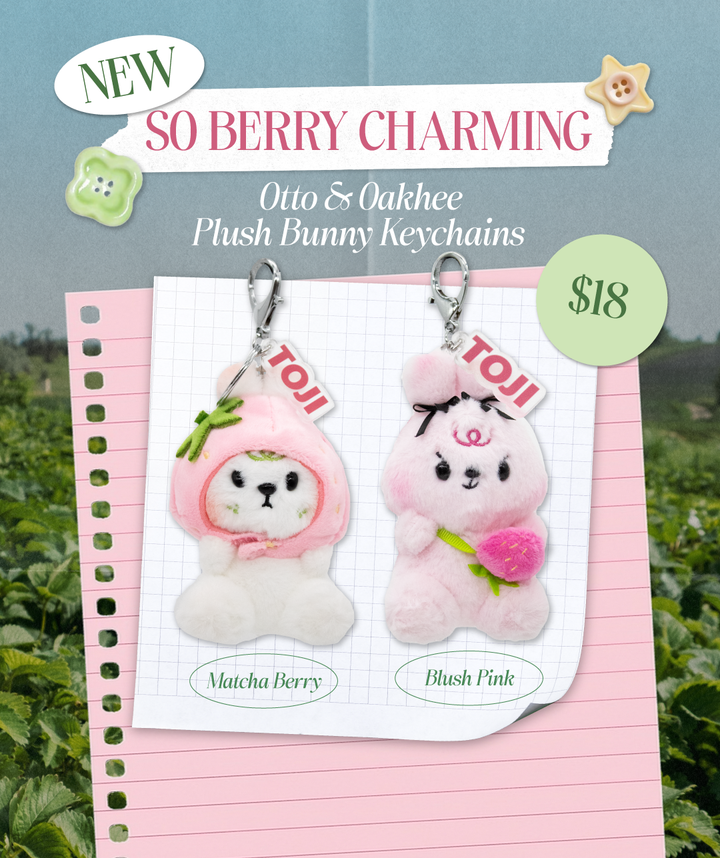 Plush bunny keychains with a berry-themed background