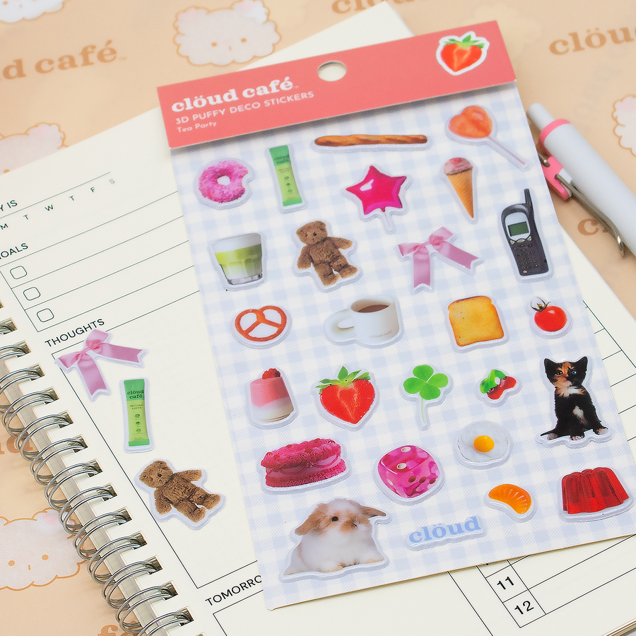 Sheet of cloud café 3D puffy deco stickers on a planner with stickers attached