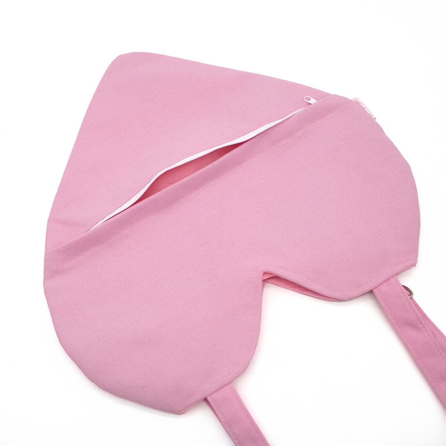 Heart-shaped pink tote bag with 'cloud cafe' text on a white background.  Zipper pocket on back of heart tote.