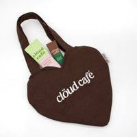 Chocolate-brown colored mini tote bag with white cloud cafe embroidered logo.
