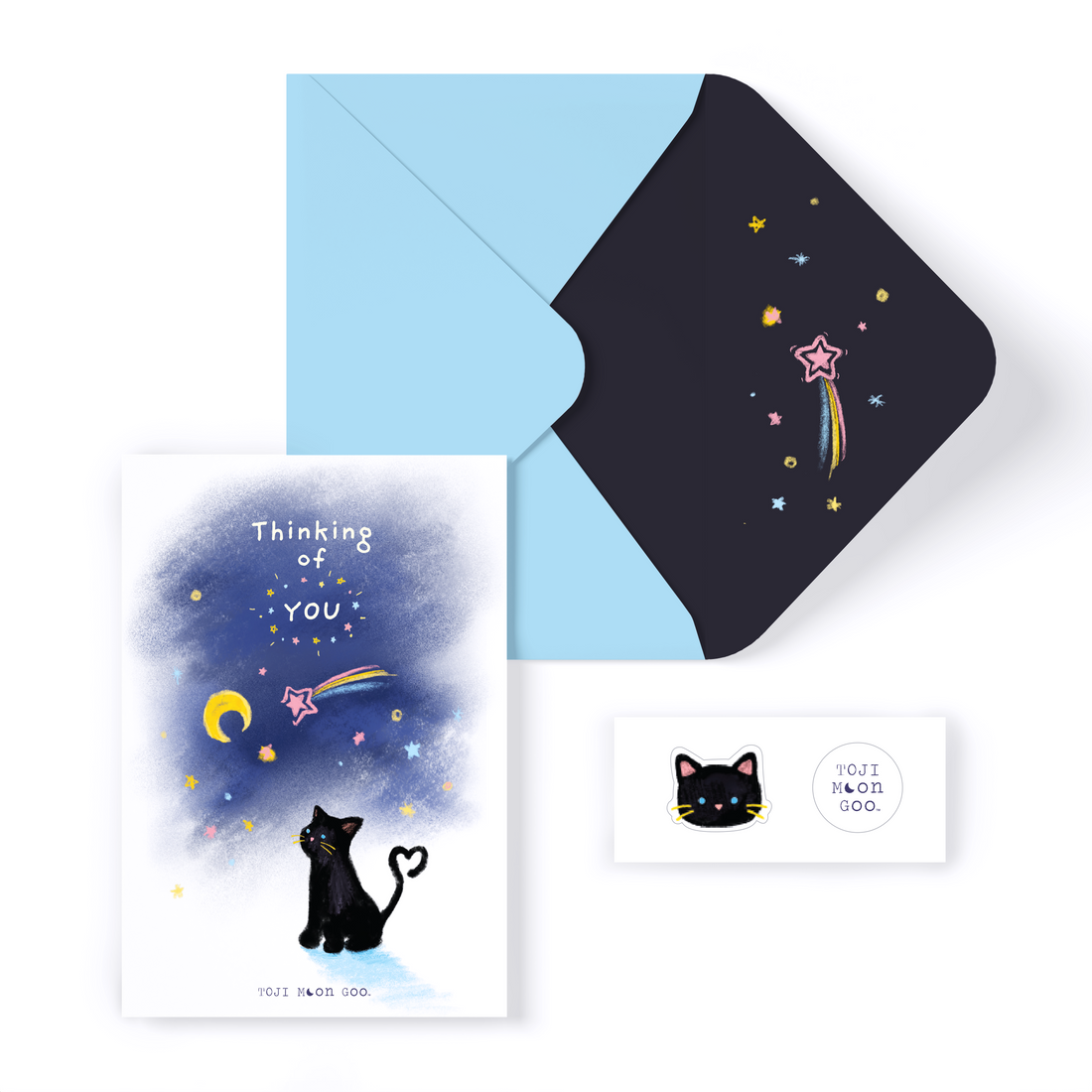 Illustration of black cat with tail curled up into a heart, looking at the night sky. Sky includes doodle stars and shooting stars, with the text reading "Thinking of you." Stickers include a black doodled cat head and TOJI MOON GOO white circle logo sticker.