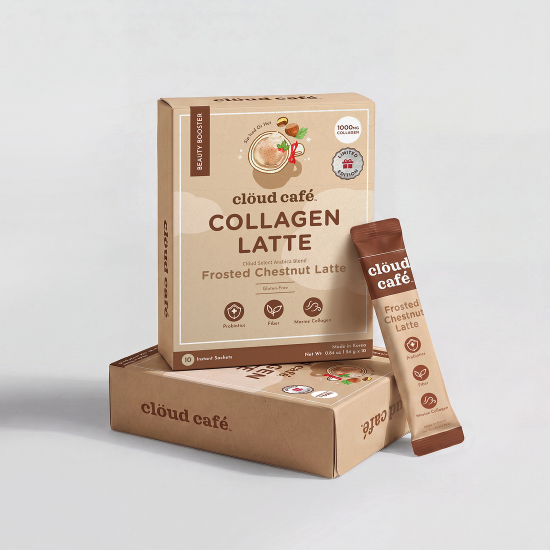 Clöud Café Frosted Chestnut Latte Collagen Latte box with 10 instant sachets, featuring Probiotics, Fiber, and Marine Collagen, gluten-free, shown with a second box and single sachet.
