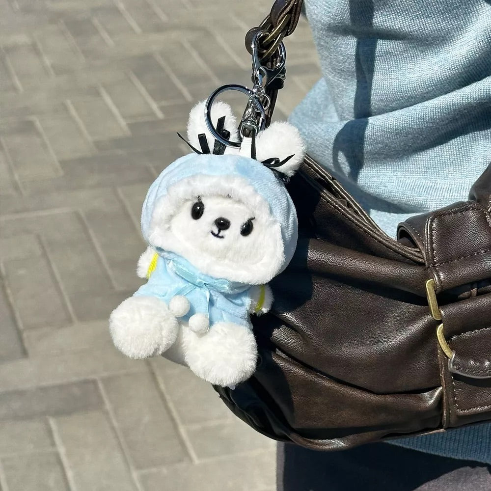 Plush Snowbunnie Keychain on brown leather bag
