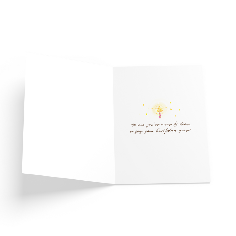 Inner card message with an illustration of a star candle.