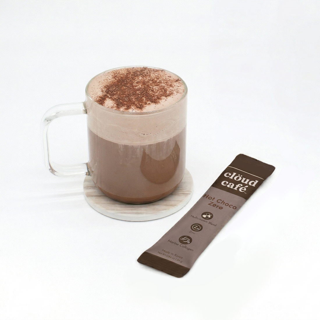 Glass mug with hot chocolate and a cloud café chocolate zero sachet on a white background