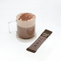 Glass mug with hot chocolate and a cloud café chocolate zero sachet on a white background