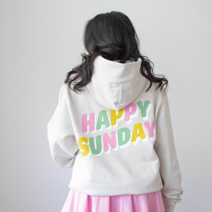 Happy Sunday Cream Hoodie back: "HAPPY SUNDAY" letters in pink, green, and yellow.