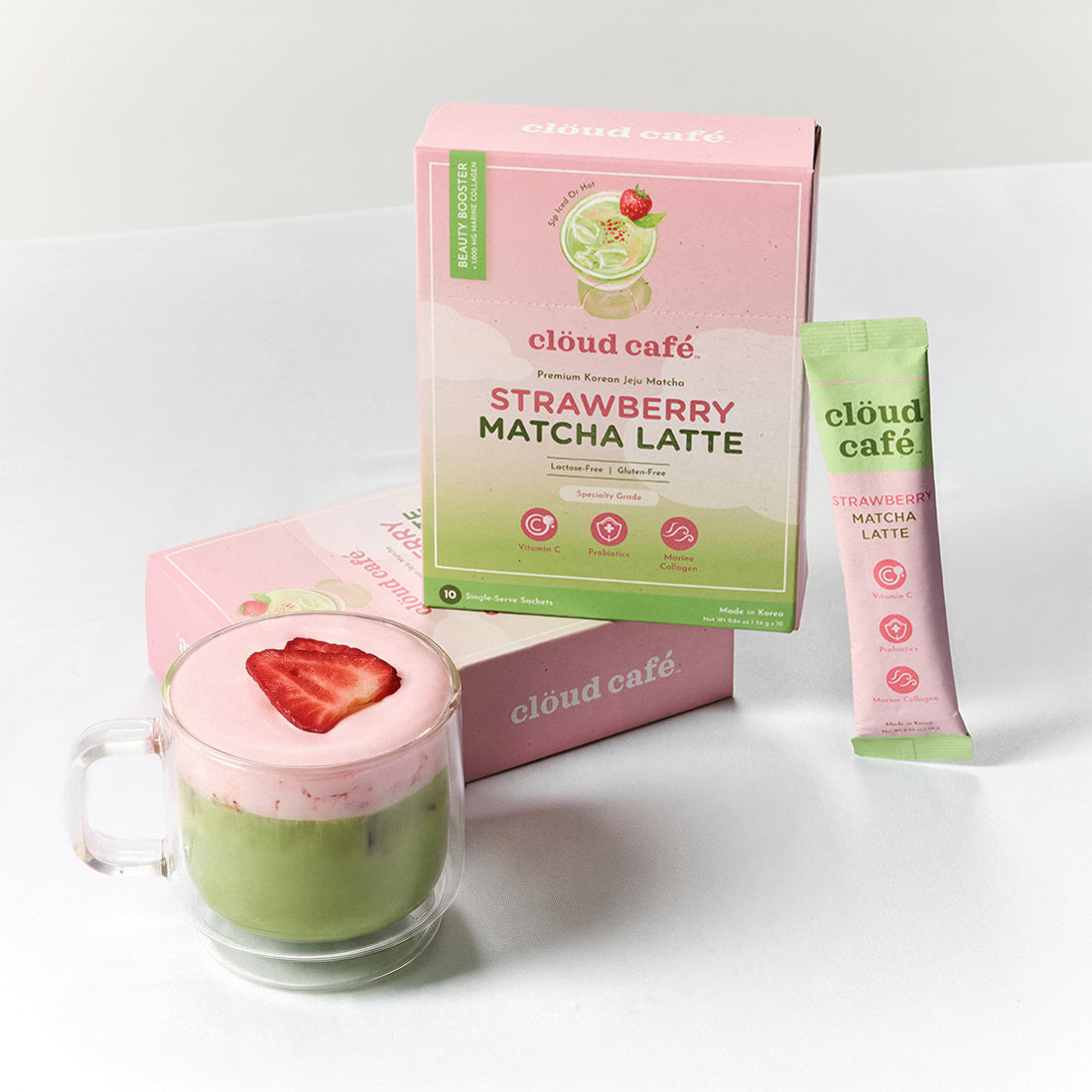 Cloud Cafe Strawberry Matcha Latte packaging with a glass of matcha latte on a white background