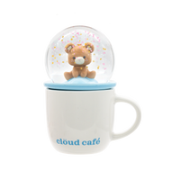 Snow globe with a bear inside on a Cloud Cafe mug.