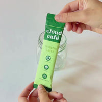 A step-by-step preparation of an iced Matcha latte. Add Clöud Café powder, a little bit of hot water, stir until smooth and frothy. Top with more water or milk to your desired taste. Drink iced or hot. 