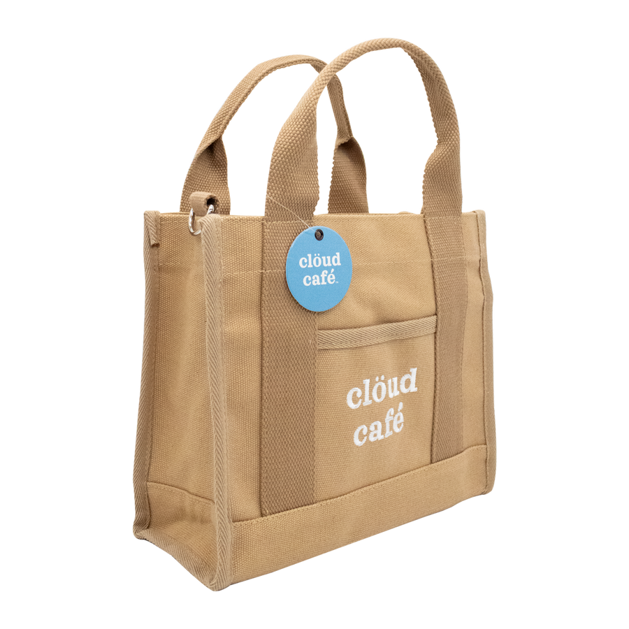 Side-facing brown canvas tote bag with embroidered "Clöud Café" logo text.